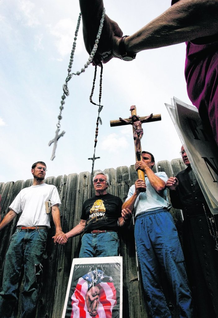 Activists pray outside an abortion clinic in Wichita, Kan., in 2007.