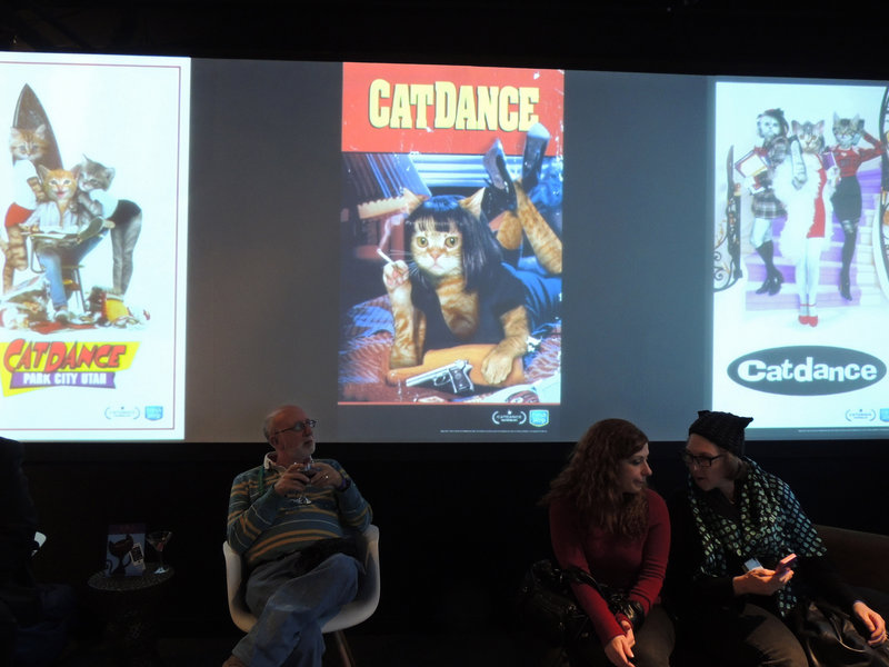 Cat lovers sit among feline-inspired movie poster spoofs Saturday at Catdance, a celebration of camera-worthy cats, at the Sundance Film Festival in Park City, Utah.