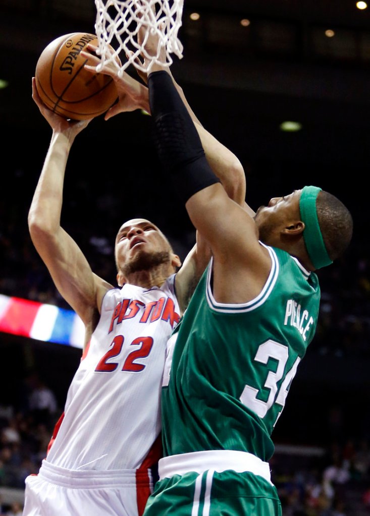 Celtics forward Paul Pierce, right, defends against Pistons forward Tayshaun Prince in the first half of Detroit’s 103-88 win on Sunday.