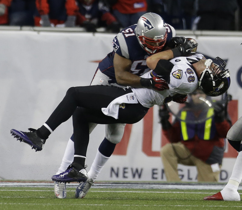Patriots linebacker Jerod Mayo delivers a big hit after a catch by Ravens tight end Dennis Pitta in the third quarter. Pitta recovered quickly and caught the go-ahead touchdown pass on the next play.