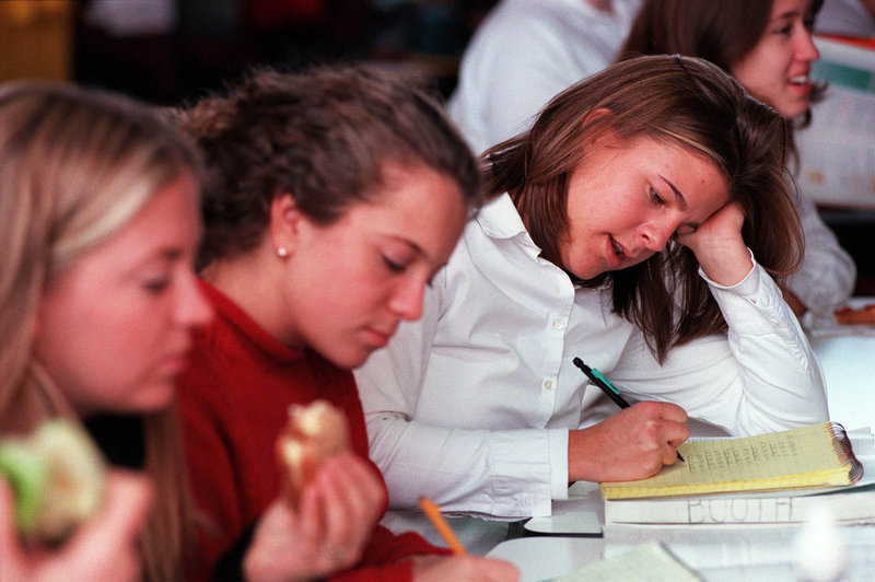 A Catherine McAuley High School student prepares for a test during lunch period in a 2000 file photo. A McAuley teacher questions a letter that he said “baselessly denigrates” the Portland school.