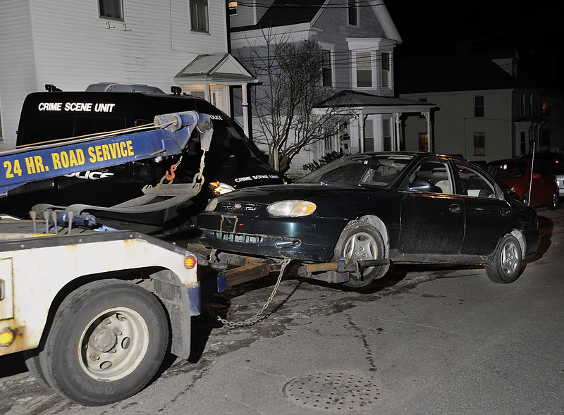 Police towed a car from the driveway of the 266 West Concord St. for analysis