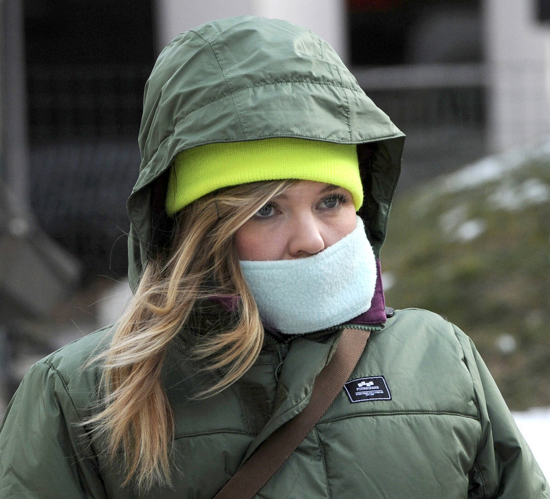 Kristin O'Brien from Portland was one of many pedestrians who braved the cold and wind Tuesday, Jan. 22, 2013.