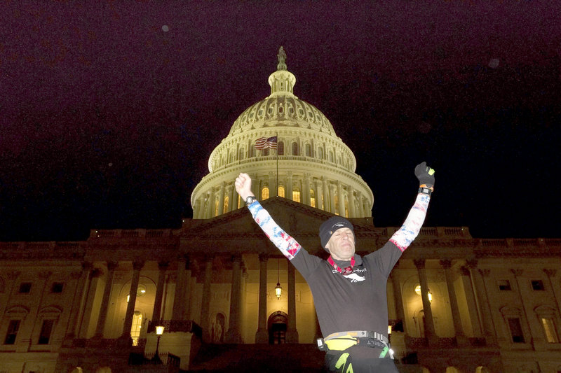 Exhausted from his run, 56-year-old Gary Allen from Great Cranberry Island, Maine, celebrates after finally reaching the U.S. Capitol on Monday night, Jan. 21, 2012. Allen averaged 50 miles a day as he ran 700 miles from Maine to Washington, DC, in two weeks for charity.