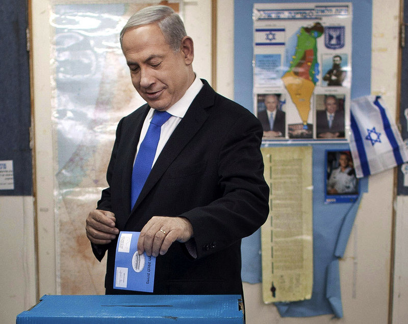 Israeli Prime Minister Benjamin Netanyahu casts his ballot at a polling station in Jerusalem on Tuesday.