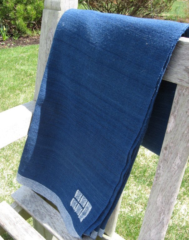 Swans Island Blankets’ solid indigo throw sells for $495. The company makes hand-woven products with certified organic fibers and natural dyes.