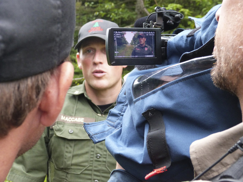 Warden Kris MacCabe with Producer Ben Shank and Cameraman Joe Brunette near Canadian border.