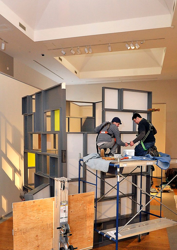 Architalx volunteers Joe Peters, left, and Martin Simpson assemble the “touch tower” at the Portland Museum of Art.