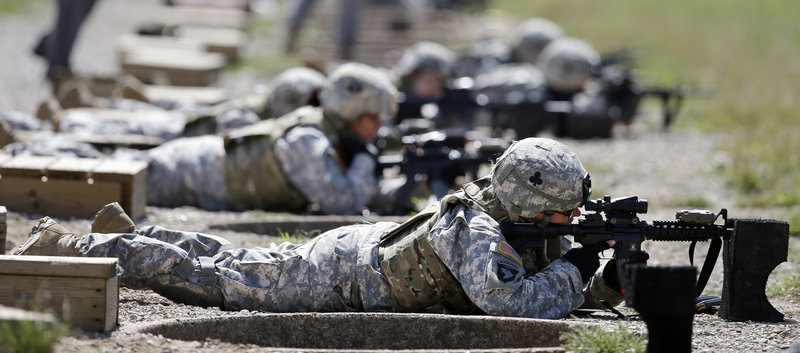 Female soldiers from 1st Brigade Combat Team, 101st Airborne Division train for duty in Afghanistan on a firing range in Fort Campbell, Ky., in September.