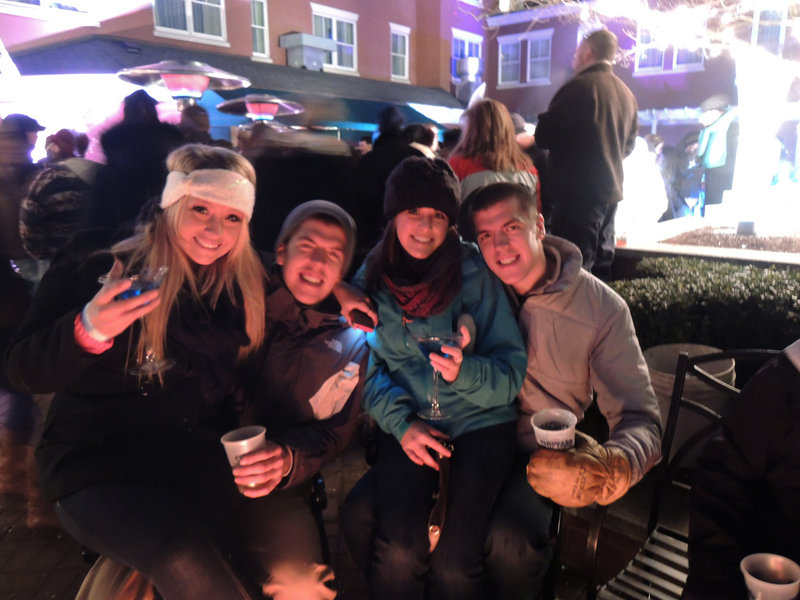 Brooke Taylor, who recently moved here from Colorado, snagged a seat to enjoy her beverage fireside with Portland natives and fellow revelers Andrew Baxter, Tori Ripley and Morgan Baxter.