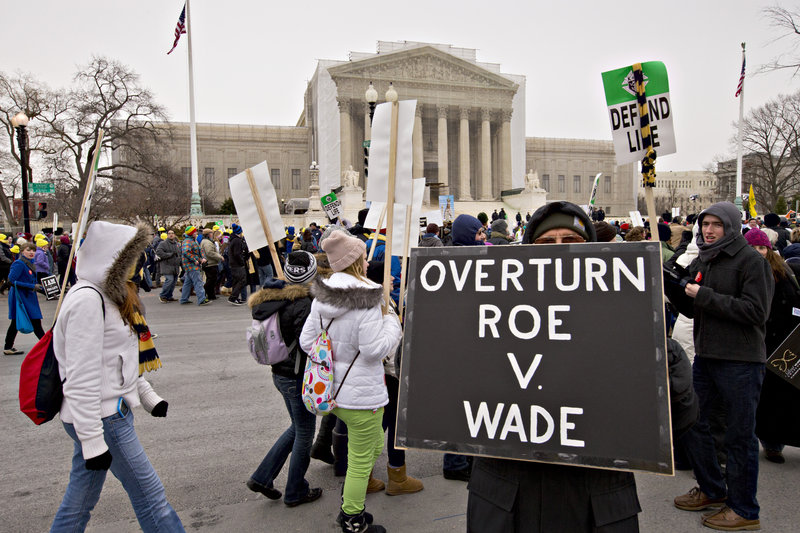 Anti-abortion activists march past the U.S. Supreme Court on Friday in Washington, as a large crowd observed the 40th anniversary of the landmark Roe v. Wade decision by marching through the nation’s capital.