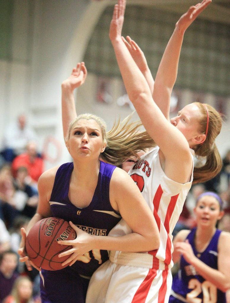 Cassidy Grover tries to get off a shot against South Portland’s Hope Owen during Cheverus’ 43-33 win Friday.