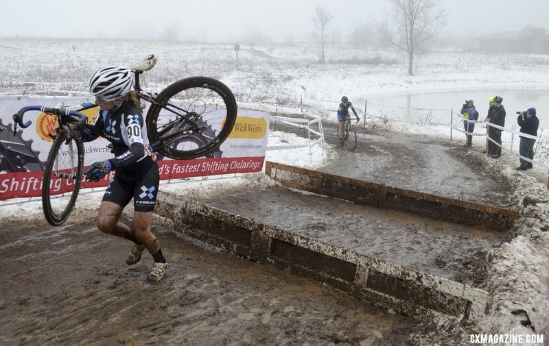 Ellen Noble carries her bike over an obstacle at the USA Cycling Cyclo-cross Nationals in Wisconsin on Jan. 11.