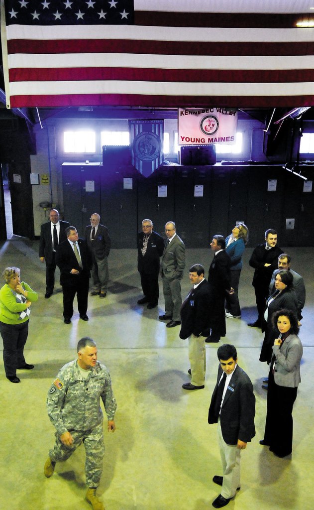 Army National Guard Lt. Col. Dwaine Drummond leads members of the Legislature’s Veterans and Legal Affairs Committee on a tour of the Gardiner Armory on Jan. 23.