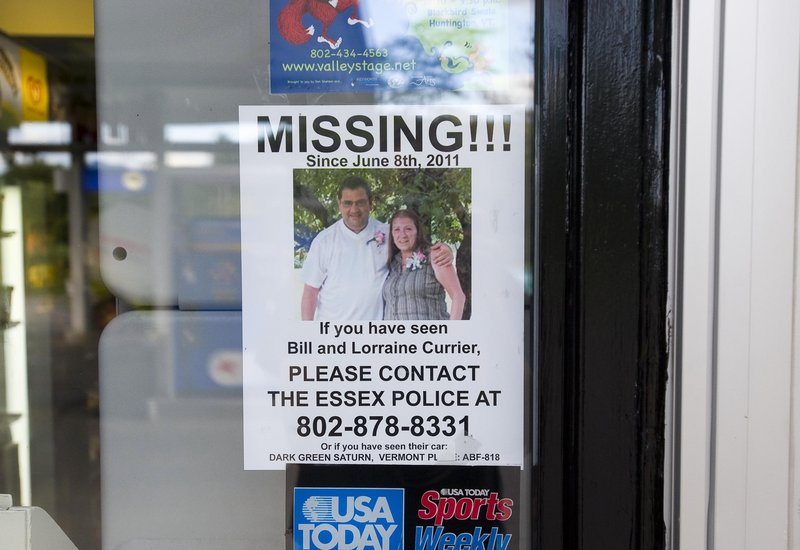 A poster seeking information about Bill and Lorraine Currier of Essex, Vt., hangs in the window of the Richmond, Vt., Mobil station in 2011. Israel Keyes is suspected of killing the couple.