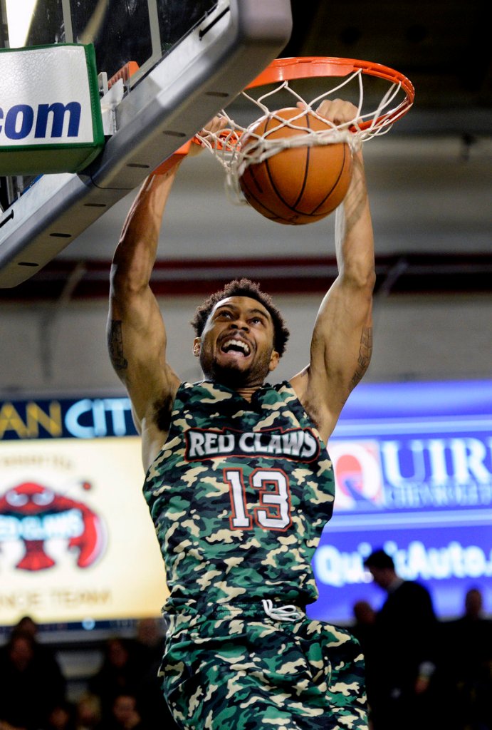 Maine guard Xavier Silas puts home dunk in the Red Claws’ 120-112 win over Springfield on Sunday. Silas scored 24 points, second on the team behind Chris Wright’s 25.