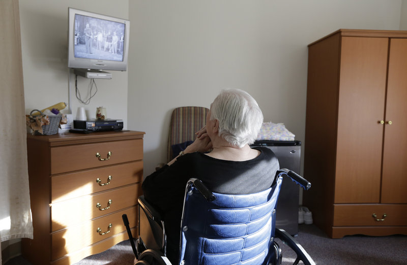 An elderly woman watches "I Love Lucy" on a television inside her room at Cedar Village retirement community in Mason, Ohio. The Shalom Center, which is a part of the community, offers shelter, along with medical, psychological and legal help, to elderly abuse victims in this northern Cincinnati suburb. The center asked that this woman's identity be protected for this story because the close relatives who allegedly abused her don't know where she is.