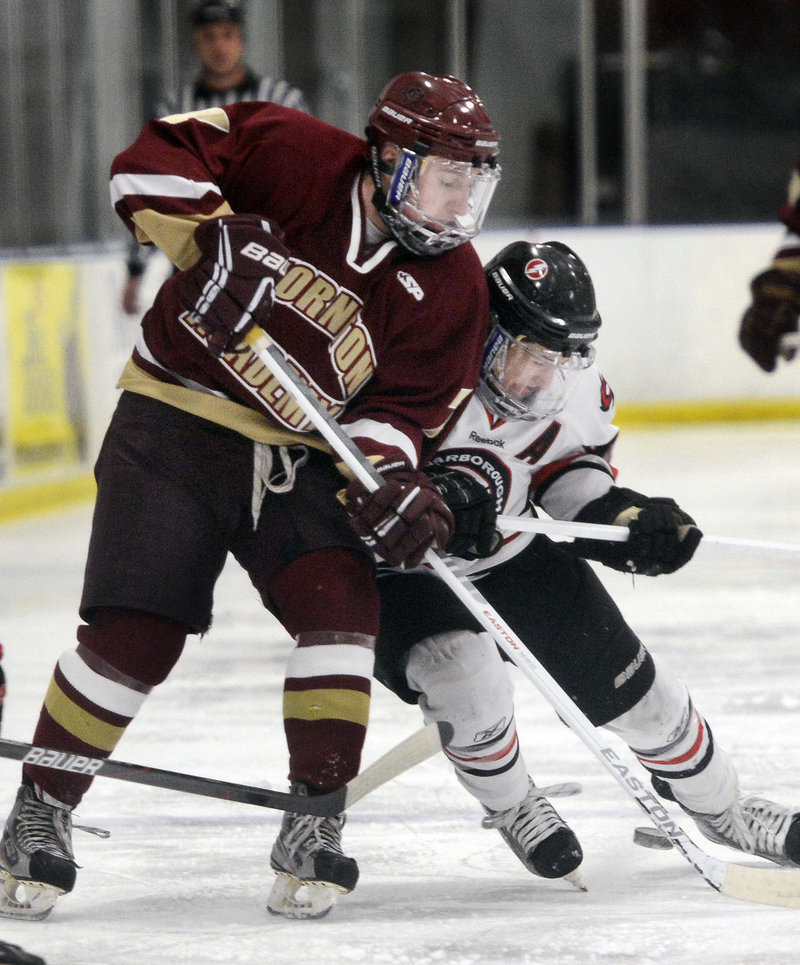 Ben Bragg, right, of Scarborough battles with Thornton Academy’s Stephen Comar during Scarborough’s 4-3 win at Saco on Monday afternoon. The Red Storm improved to 12-1.