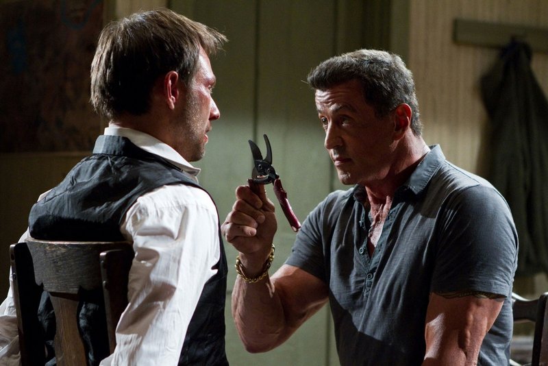 Christian Slater, left, and Sylvester Stallone square off in “Bullet to the Head.”