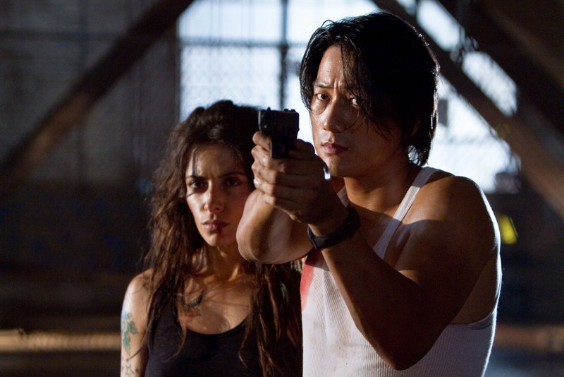 Sarah Shahi and Sung Kang in director Walter Hill’s return to the buddy-cop genre.