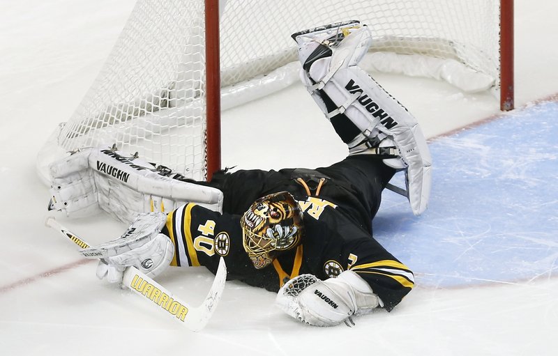 Tuukka Rask of the Bruins sprawls to make a save on David Clarkson of New Jersey during the shootout phase of Boston’s 2-1 victory Tuesday night.