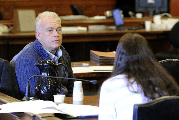Barry Spencer talks with his wife Paula during the second day of the Spencers' trial for allegedly allowing teens to drink at their home in Falmouth last year.