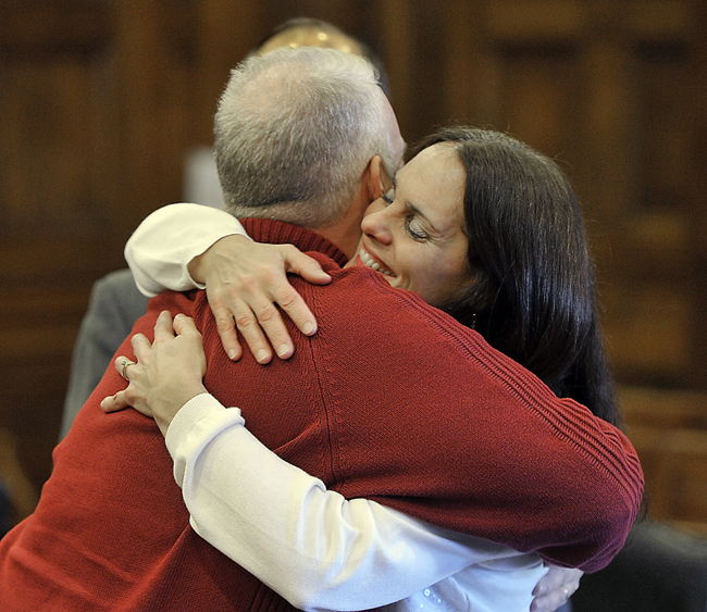 On Thursday, Feb. 07, 2013, Barry and Paula Spencer hug with joy after hearing the jury was deadlocked with the verdict resulting in a mistrial. Like the jury, public opinion on the case is split.
