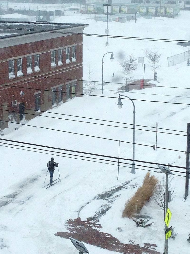 An unidentified person skis down the deserted streets of Portland between Planet Fitness and Walgreens on Saturday, Feb. 9, 2013.