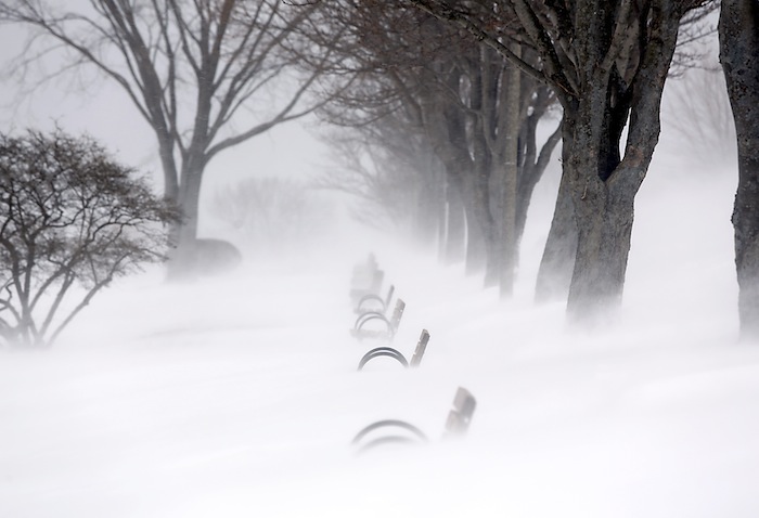 Snow blows and drifts over the benches along the Eastern Promenade during the blizzard on Munjoy Hill in Portland Saturday morning.