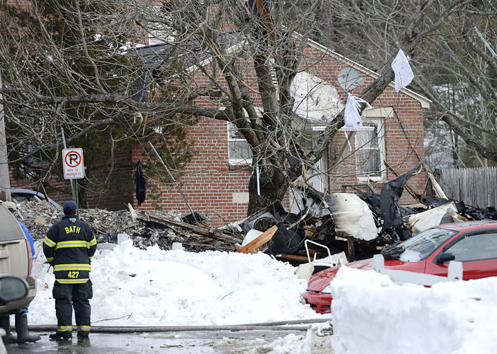 Firefighters on the scene of the explosion in Bath on Tuesday. Authorities say debris from the explosion landed as far as a quarter-mile away.