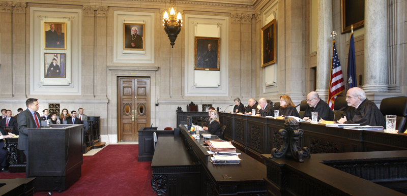 Assistant District Attorney Patrick Gordon takes questions from justices of the Maine Supreme Judicial Court in Portland on Wednesday, February 13, 2013. The court heard oral arguments in the appeal by prosecutors the dismissal of invasion of privacy charges against Mark Strong, Sr.