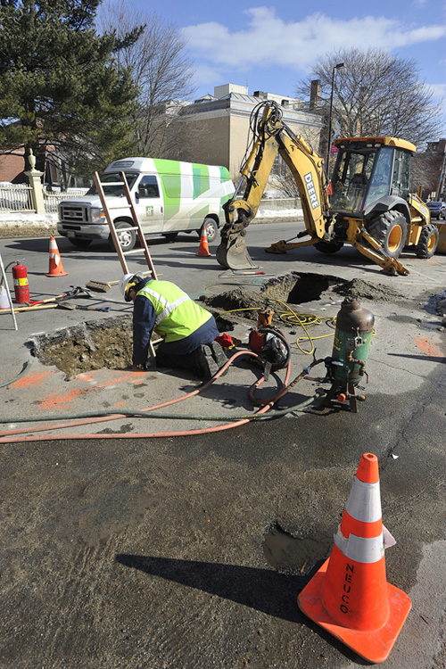 John Ewing/staff photographer: Workers from Unitil repair two natural gas line leaks on High Street in Portland on Thursday, February 14, 2013.
