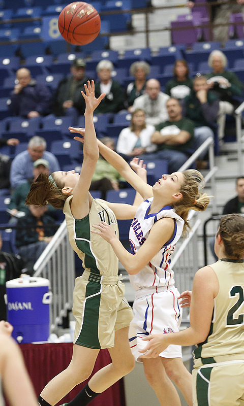 Anna Winslow, left, of Oxford Hills fouls Olivia Swan of Mt. Ararat as Swan goes up for a shot Friday in their Eastern Class A quarterfinal at Augusta. Swan scored 16 points in a 51-37 victory.