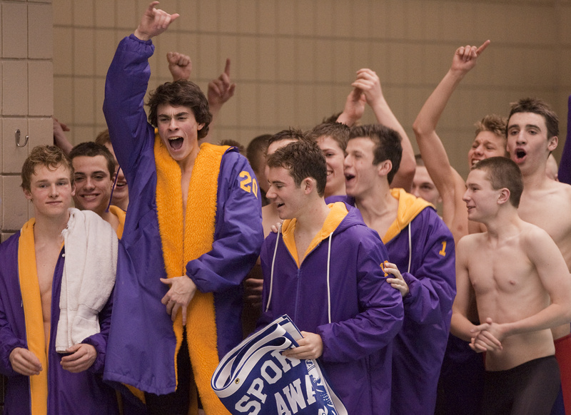 The Cheverus boys celebrate their Class A state swimming championship at Bowdoin College on Monday, after beating perennial powerhouse Bangor.