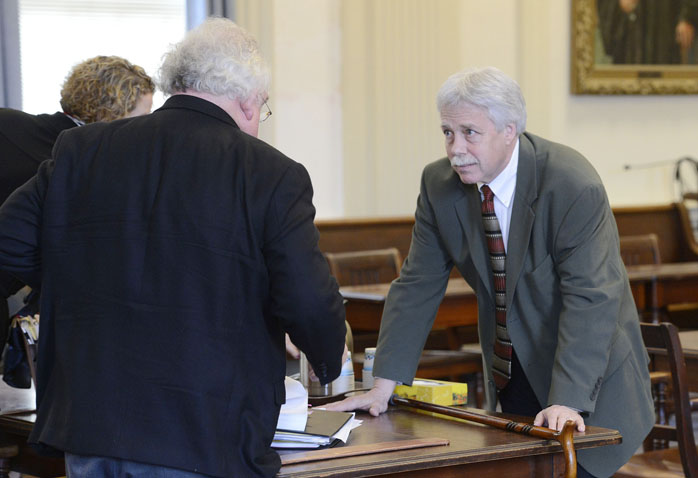 Defendant Mark Strong Sr., right, talks with his attorney Daniel Lilley after a hearing Tuesday morning in York County Superior Court.