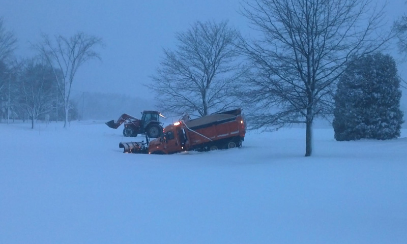 A Westbrook city plow truck partially drove into a pond at Smiling Hill Farm, while using its circular driveway to change direction on County Road on Sunday afternoon.