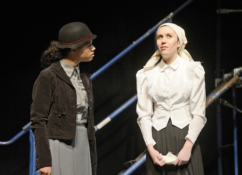 Rachel Doering and Natalie Veilleux portray factory workers during rehearsal at Deering High School for the oce-act play "Tribute" on Tuesday, Feb. 26, 2013.