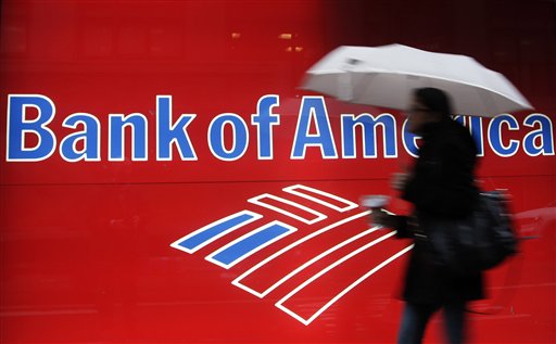 In this Dec. 7, 2012 photo, a woman passes a Bank of America office branch, in New York. Bank of America says its online banking website crashed Friday, Feb. 1, 2013 leaving customers unable to access their accounts. (AP Photo/Mark Lennihan)