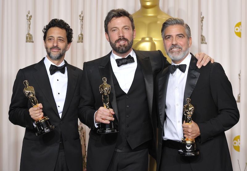 Grant Heslov, from left, Ben Affleck, and George Clooney pose with their award for best picture for "Argo" during the Oscars at the Dolby Theatre on Sunday Feb. 24, 2013, in Los Angeles. (Photo by John Shearer/Invision/AP) Oscars;Oscar