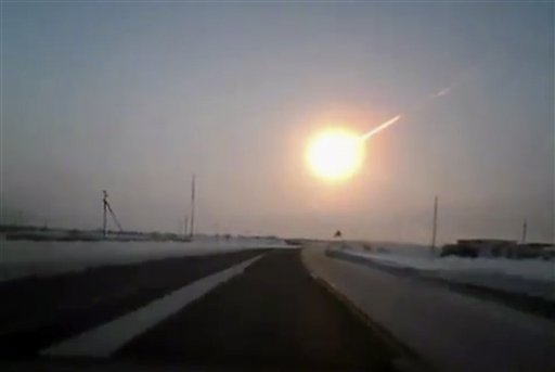 The meteor contrail is seen in this frame grab made from a video shot with a dashboard camera from a highway in Kazakhstan, Russia.