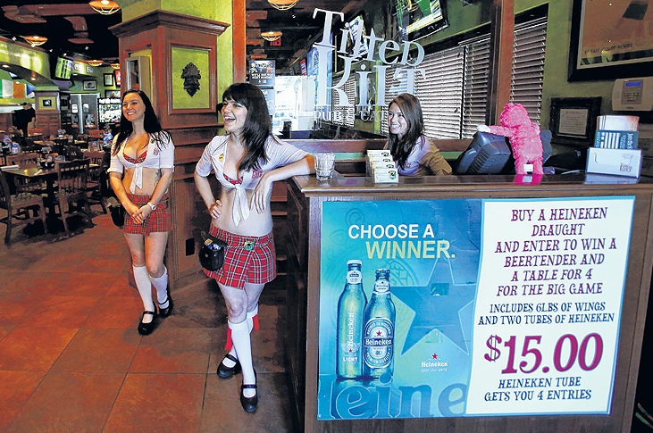 Tilted Kilt Pub & Eatery employees, from left, Kimi Hyde, Aileen Suseck and Shara Cail talk to patrons at the restaurant in Orlando, Fla. The chain is part of a dining sector featuring scantily clad waitresses. 04000000 08000000 FIN HUM krtbusiness business krtfeatures features krthumaninterest human interest krtnational national krtedonly mct 04014004 10003000 krtfood food krtleisure leisure lifestyle life krtnamer north america krttourism tourism krtusbusiness LIF restaurant TOUR u.s. us united states 08002000 curiosity ODD 2013 krt2013