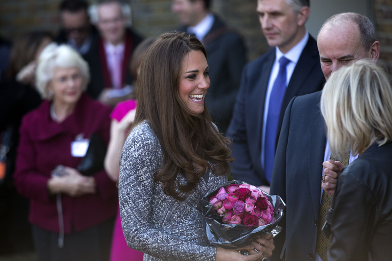 Britain's Kate, the Duchess of Cambridge, receives a bouquet of flowers Tuesday after a visit to Hope House in London, a place for women to recover from addiction, one of the causes for which she is a patron.