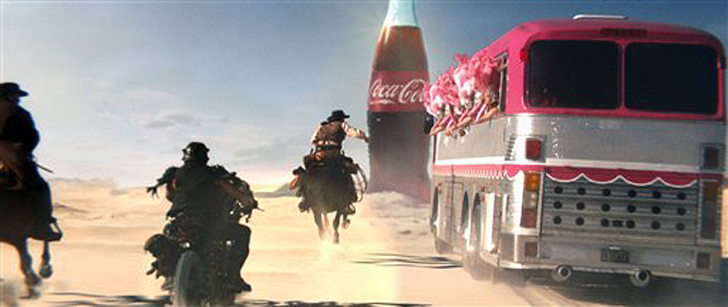 Coca-Cola created an ad based on an online campaign that pits three groups — a troupe of showgirls, biker style badlanders and cowboys — against each other in a race through a desert for a Coke.
