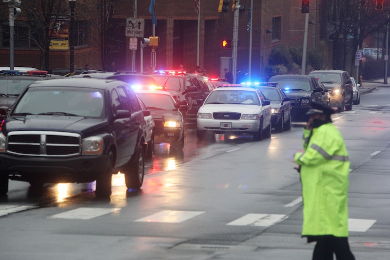 Police cars fill the street outside the New Castle County Courthouse, Monday morning, Feb. 11, 2013 in WiIlmington, Del. , after a man killed his estranged wife and two others at the courthouse. The mayor of Wilmington says police have killed the gunman. (AP Photo/The News Journal/William Bretzger) courthouse shooting