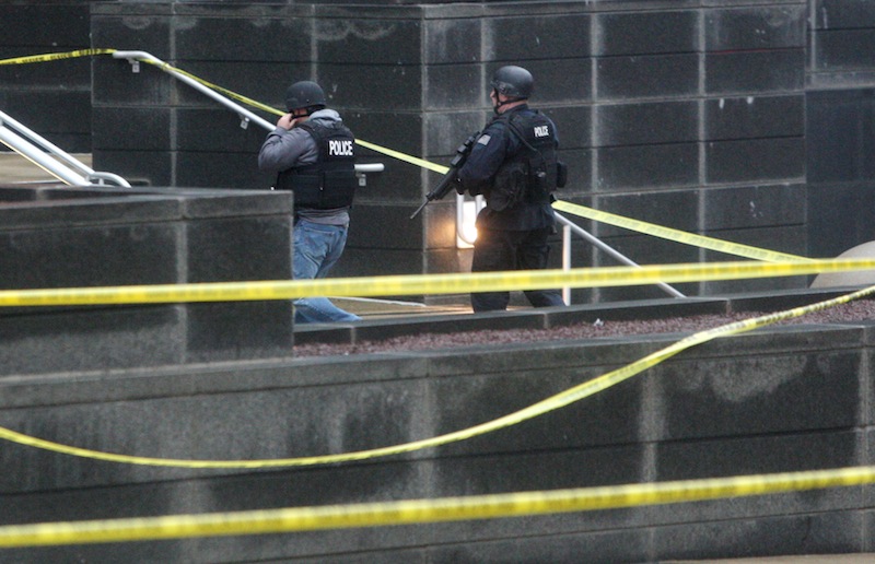 Heavily armed police enter the New Castle County Courthouse, Monday morning, Feb. 11, 2013 in Wilmington, Del. The mayor of Wilmington, Del., says a man suspected of killing his wife and wounding two others at the New Castle County Courthouse has been killed by police. (AP Photo/The News Journal/William Bretzger) courthouse shooting