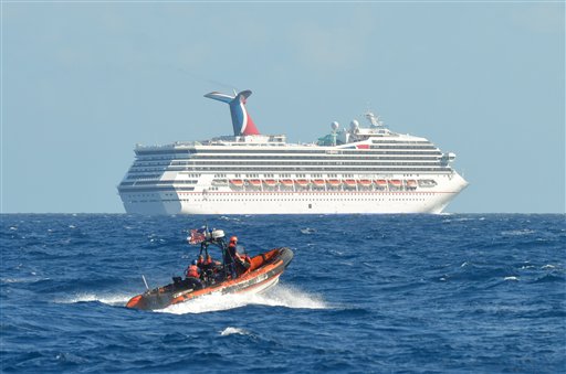 In this image released by the U.S. Coast Guard on Sunday, a boat belonging to the Coast Guard Cutter Vigorous patrols near the cruise ship Carnival Triumph in the Gulf of Mexico.