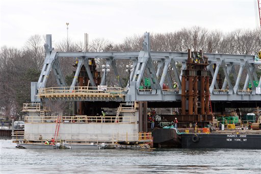 In this Jan. 15, 2013, photo, a new section of the Memorial Bridge is set into position. The new span is expected to open this summer.