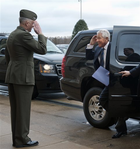 Former Sen. Chuck Hagel, R-Neb., salutes Marine Corp. Lt. Gen. Tom Waldheuser as he arrives at the Pentagon to be sworn-in as Secretary of Defense, in Arlington, Va., Wednesday. Waldheuser will be Hagel's senior military assistant.