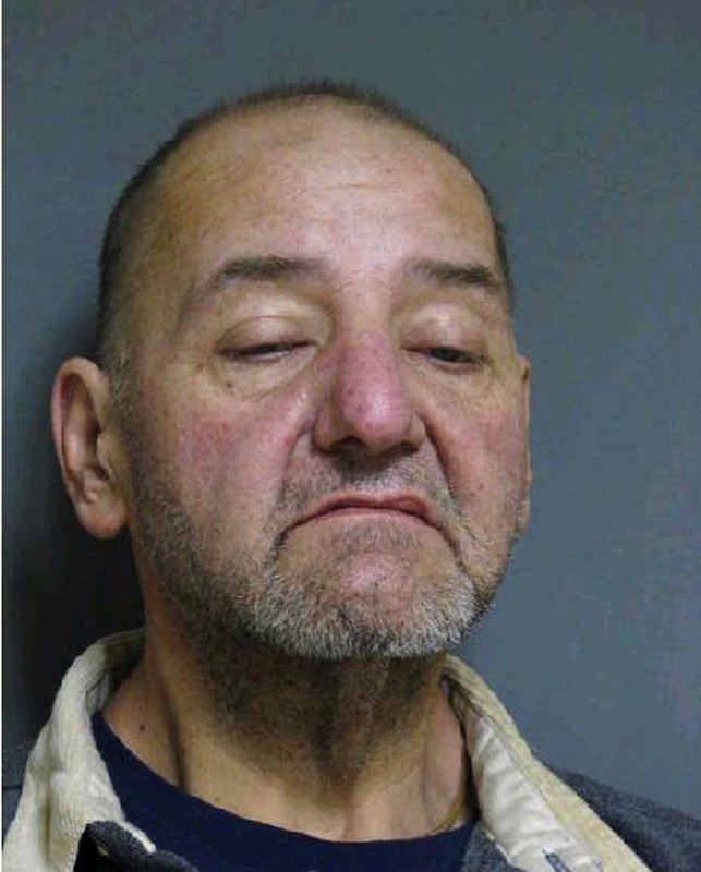 This booking photo released by Vermont State Police shows Mark Mumley, 52, of Alburgh, Vt. Authorities said four suspects, including Mumley, stole items including more than $200,000 in gold coins from a vacant home in Alburgh after its eccentric owner died in a farm accident last year. Mumley, Shawn Farrell, 41, and Ricky Benjamin, 35, were arraigned and held on $75,000 bail. A fourth suspect, Jennifer Jarvis, 32, was released after being issued a citation. (AP Photo/Vermont State Police)