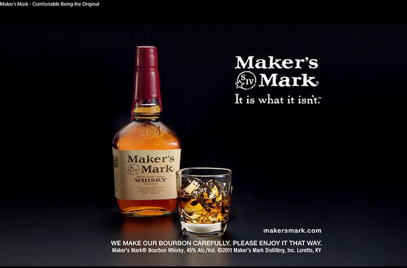 This file still frame image made from video provided by Maker's Mark Distillery Inc., shows a bottle of Maker's Mark in an advertisement. The producer of Maker's Mark bourbon is cutting — likely permanently — the amount of alcohol in each bottle to stretch every drop of the famous Kentucky whiskey. The alcohol volume is being lowered from its historic level of 45 percent to 42 percent — or 90 proof to 84 proof. (AP Photo/Marker's Mark Distillery Inc., File)